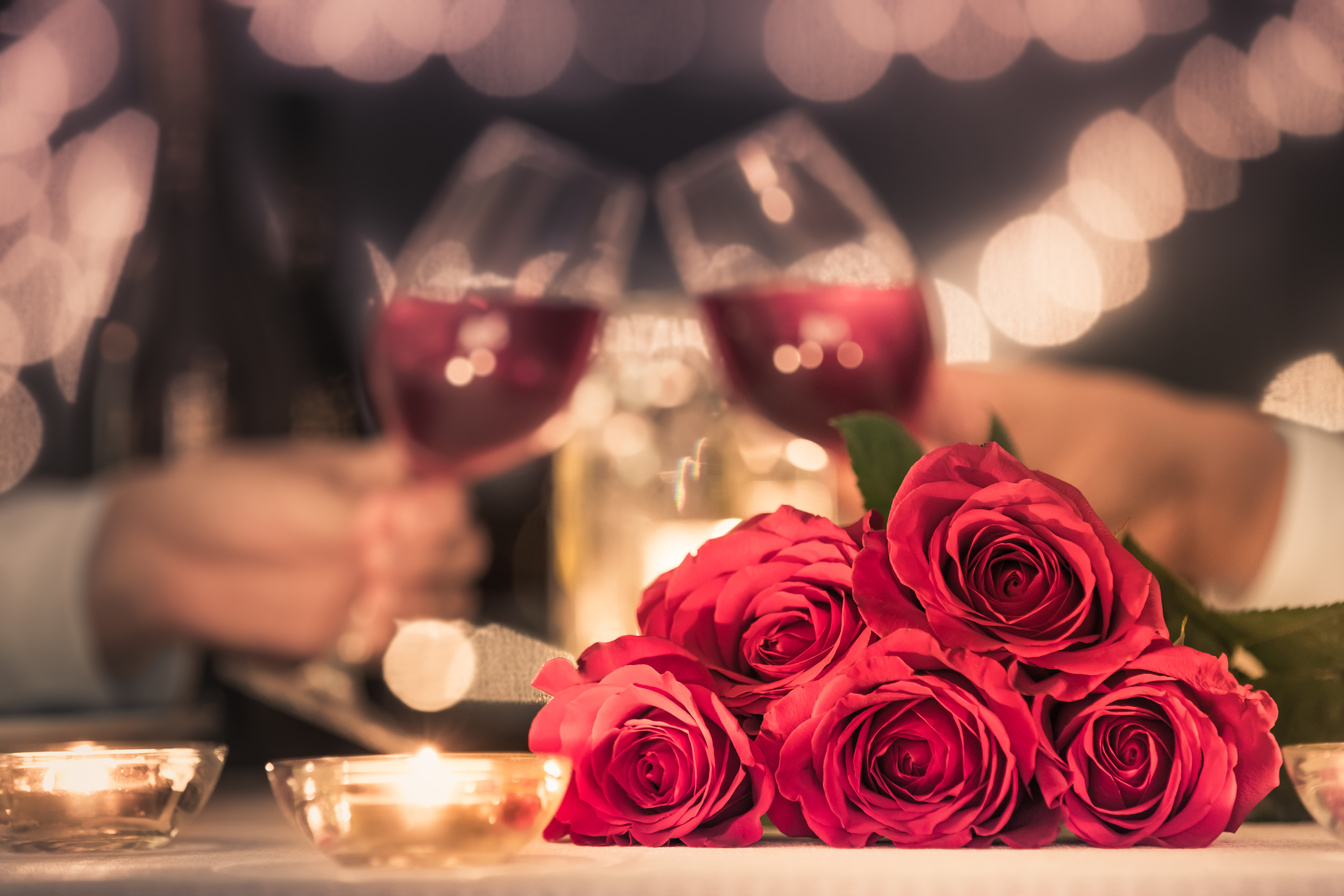 Happy couple having a romantic candle light dinner.